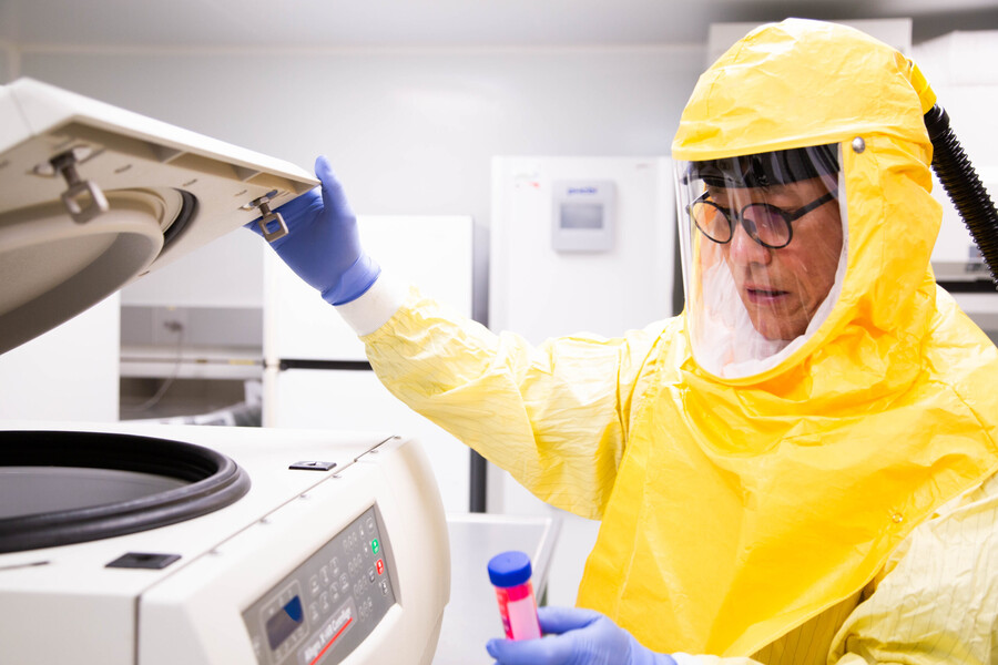 Haibo Zhang examines a sample in a lab