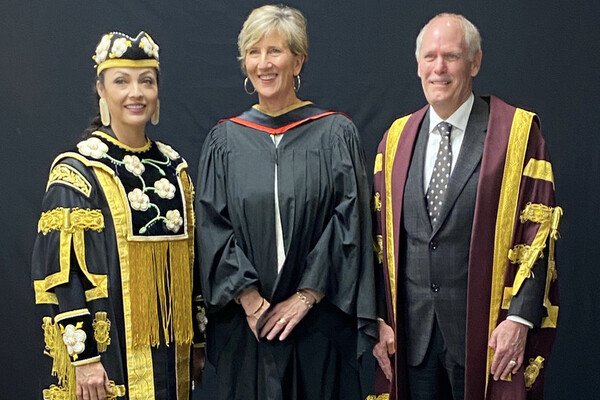 Dr. Fiona Campbell stands between Santee Smith and David Farrar of McMaster University