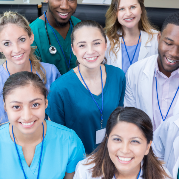Group of medicial professionals smile at camera