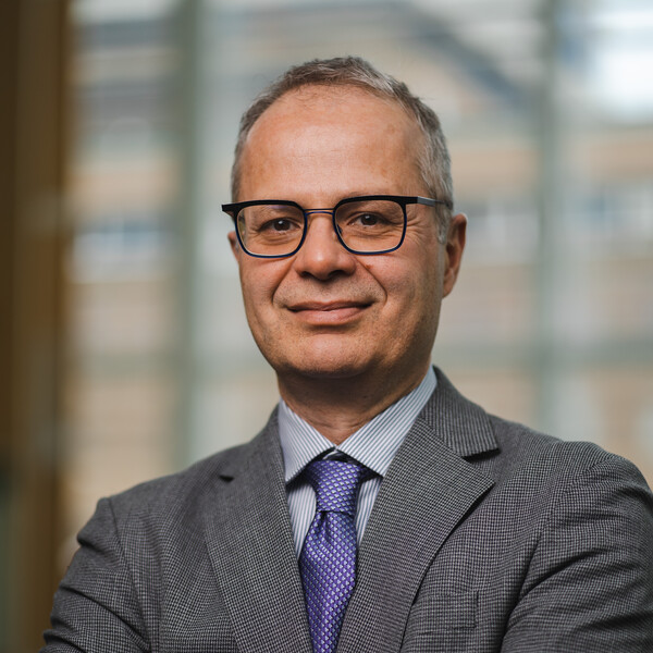 Dr. Keyvan Karkouti in a suit
